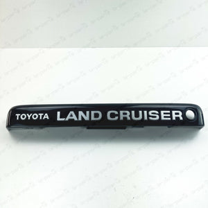 NEW GENUINE TOYOTA LAND CRUISER 80 LICENSE PLATE LAMP COVER 81276-60130