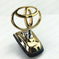 GENUINE TOYOTA 98-07 LAND CRUISER 100 HOOD EMBLEM BADGE GOLD 75303-60080