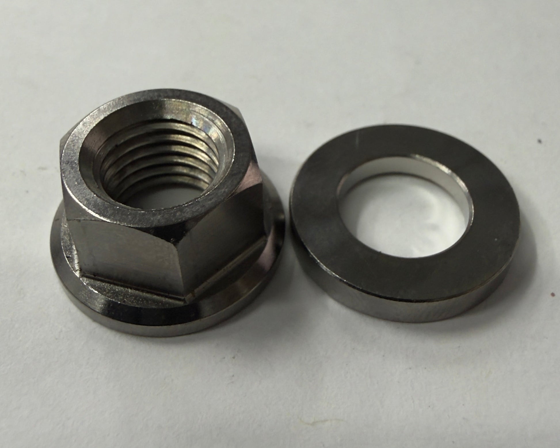Metal nut and washer on a white background